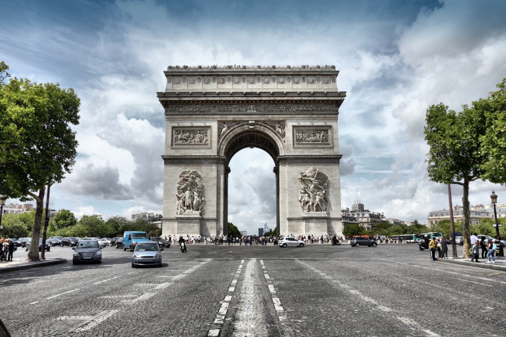 Paris, France - famous Triumphal Arch located at the end of Champs-Elysees street. UNESCO World Heritage Site. HDR photo.